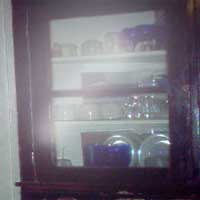 Cabinet ghost in New Orleans uptown home photo by Halley Smith.