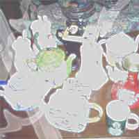 ANTIQUE TEAPOT COLLECTION AND GHOST IN MAGAZINE STREET SHOP. PHOTO BY DELANE G.