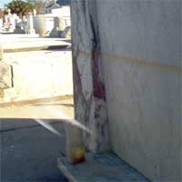 High water Mark from hurricane Katrina a face in the marble and a ghostly mist photo by Greg S. taken at saint Louis Cemetery Number 3.