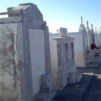 faces on the sided of this tomb that was flooded you can see the high water and a mans face clearly says Karen Yoda.