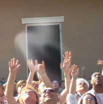 Ghost float over a crowd beneath a balcony in New Orleans. photo sent to us by David.