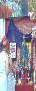  Vodoun Devotees in an offering to the spirit of Ezili Danto, the black Madonna. 